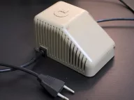 Commodore 64 power supply brick with its cable and mains plug