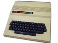 A Dragon 32 home computer, beige case with grey function keys, on a desk