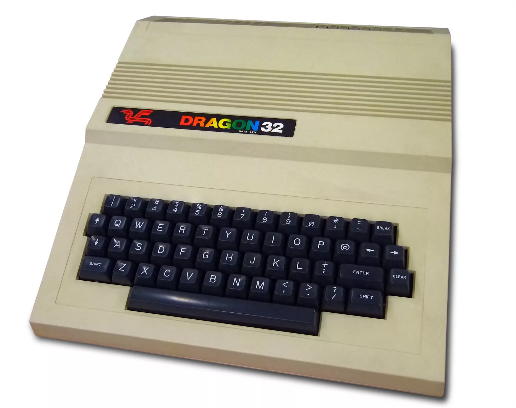 A Dragon 32 home computer, beige case with grey function keys, on a desk