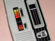 Mattel Electronics Auto Race handheld game from 1976, showing the gear switch, start/reset slider and red LED racetrack window