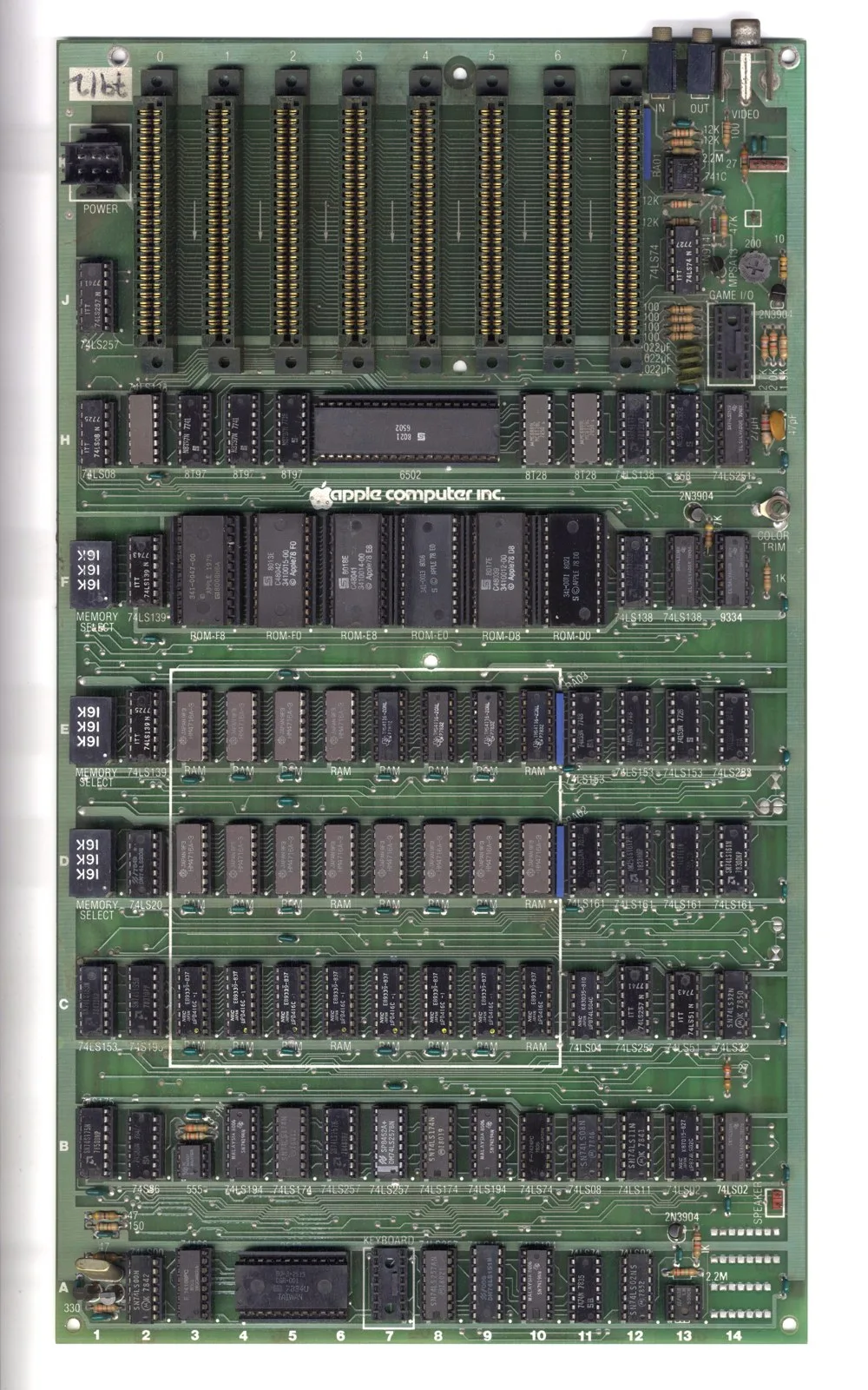 An Apple II mainboard (j-plus revision) showing the eight numbered expansion slots, the 6502 CPU and the ROM and RAM banks