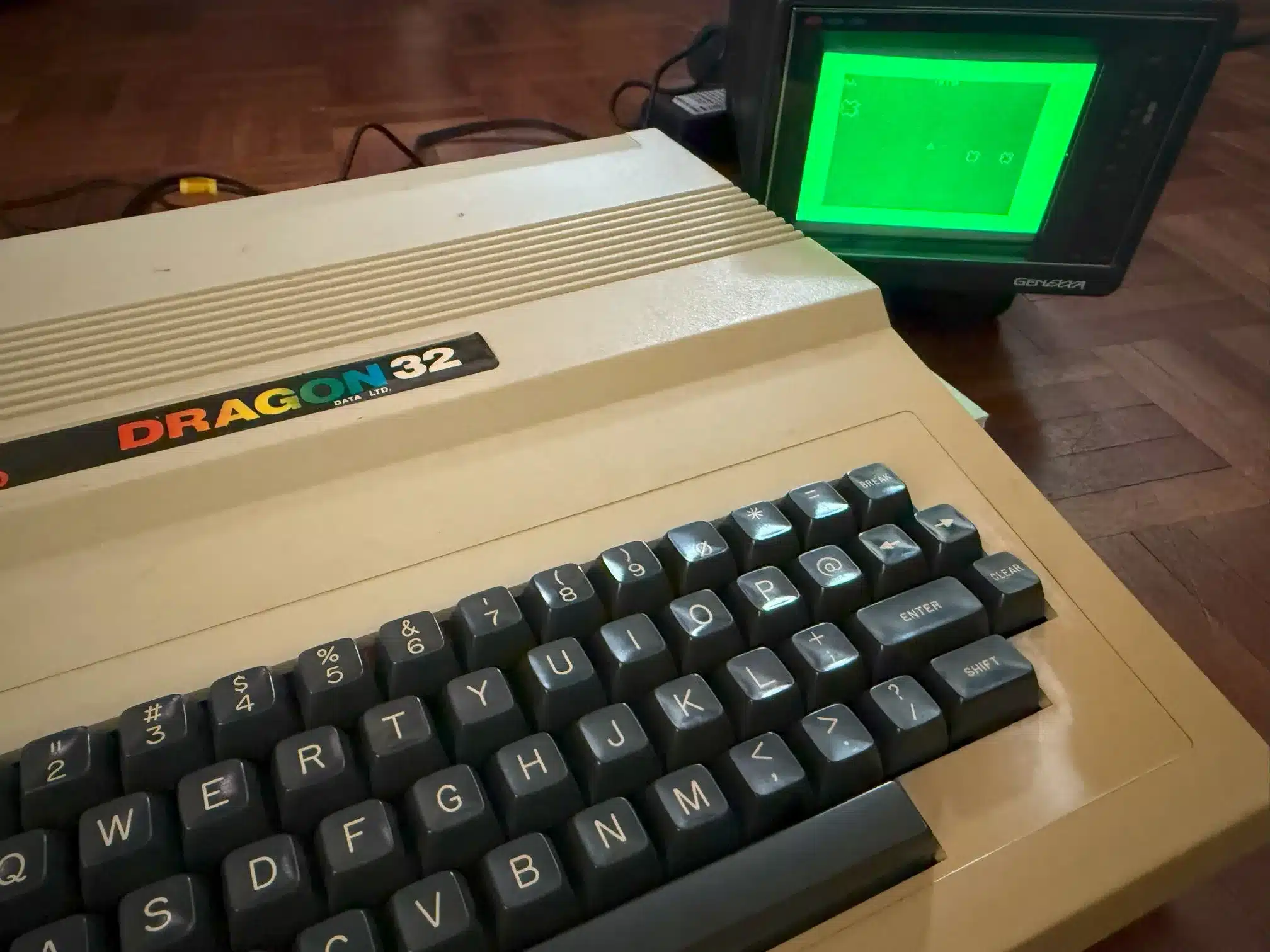 A Dragon 32 connected to a green-screen monitor mid-session.