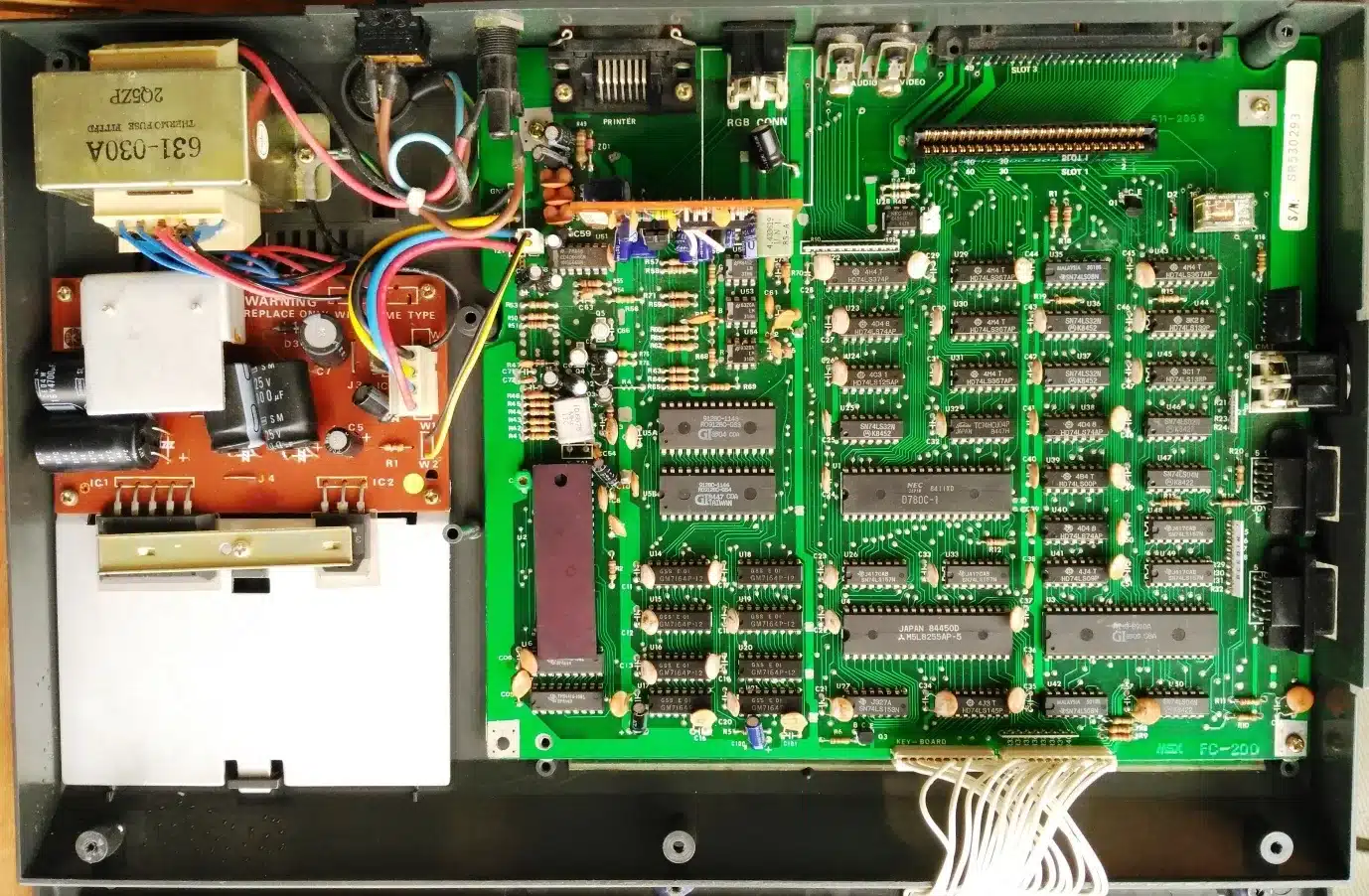 Inside the Goldstar FC-200 showing the power supply and main board