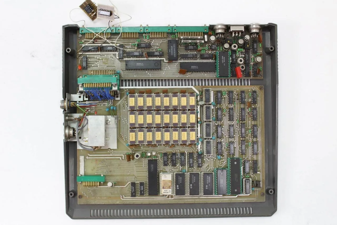 The PMD 85-1 mainboard, showing the MHB 8080A CPU and Tesla logic chips.