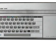 The Timex Sinclair 2068 in its silver wedge case, showing the cartridge port and hard plastic keyboard
