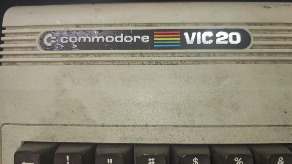 Marks on the VIC-20 badge, before cleaning
