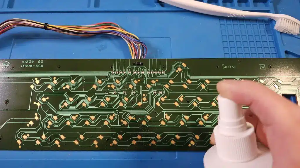 Cleaning the keyboard circuit board with alcohol