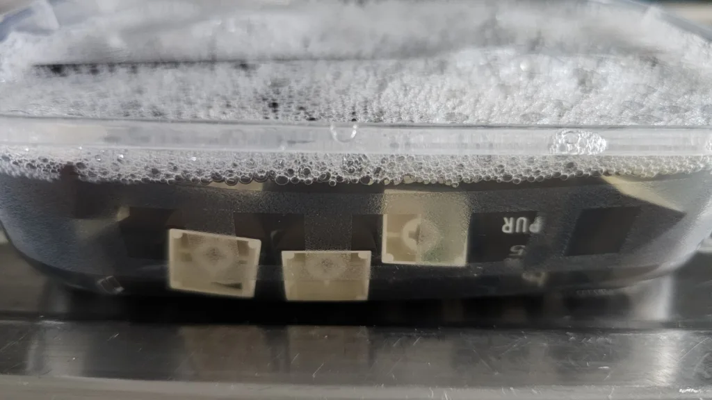 The keycaps soaking in warm, soapy water