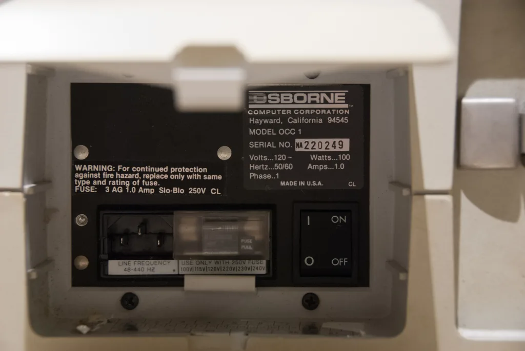 Osborne 1 rear panel with maker label and power switch