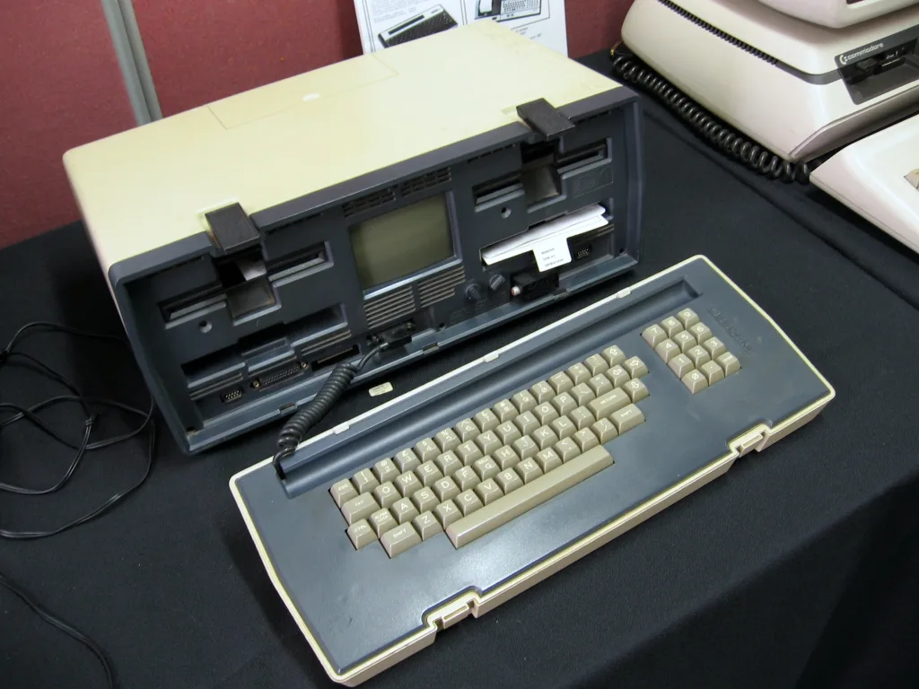 Osborne 1 open on display with screen and drives visible