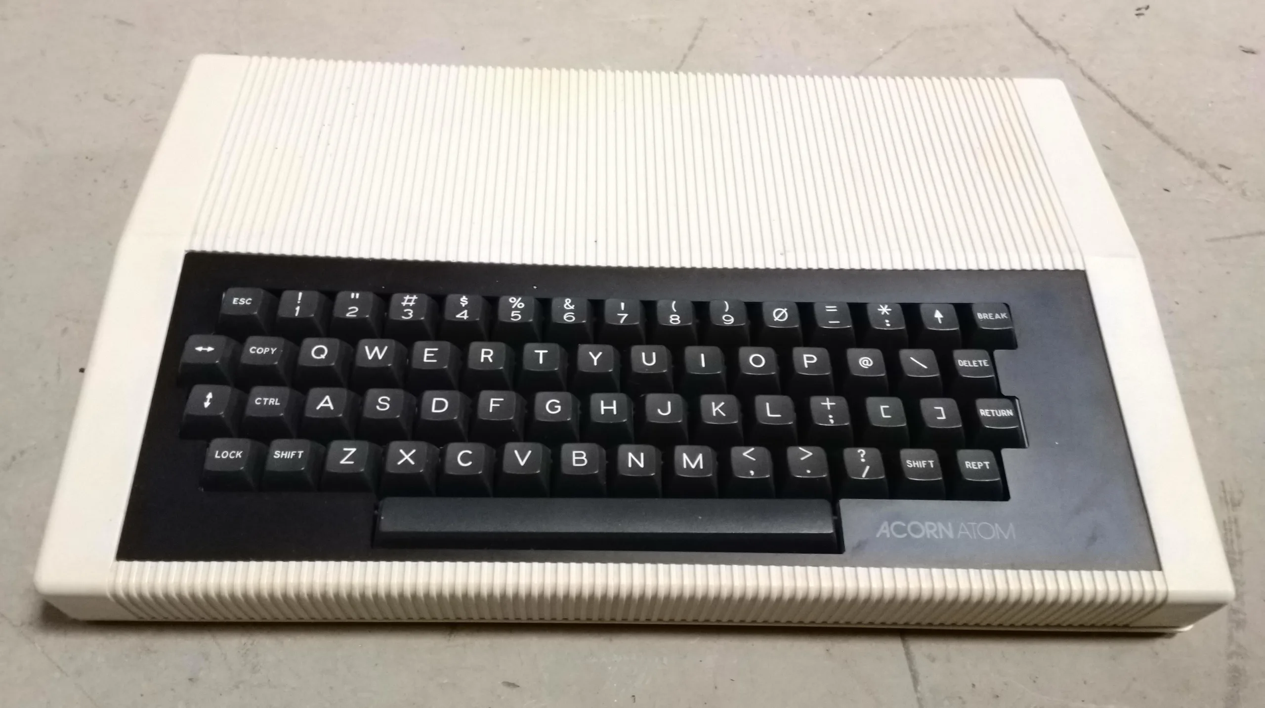 Acorn Atom home computer in its cream ribbed case