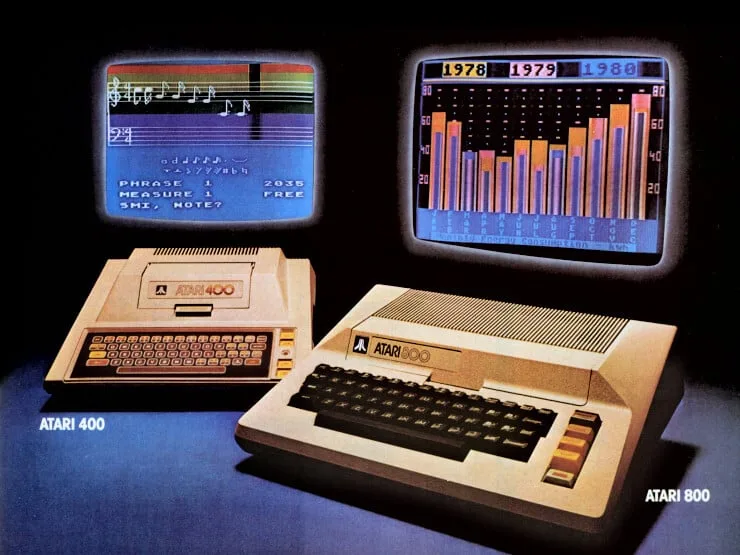 Period advert showing the Atari 400 and Atari 800 with two screens behind them