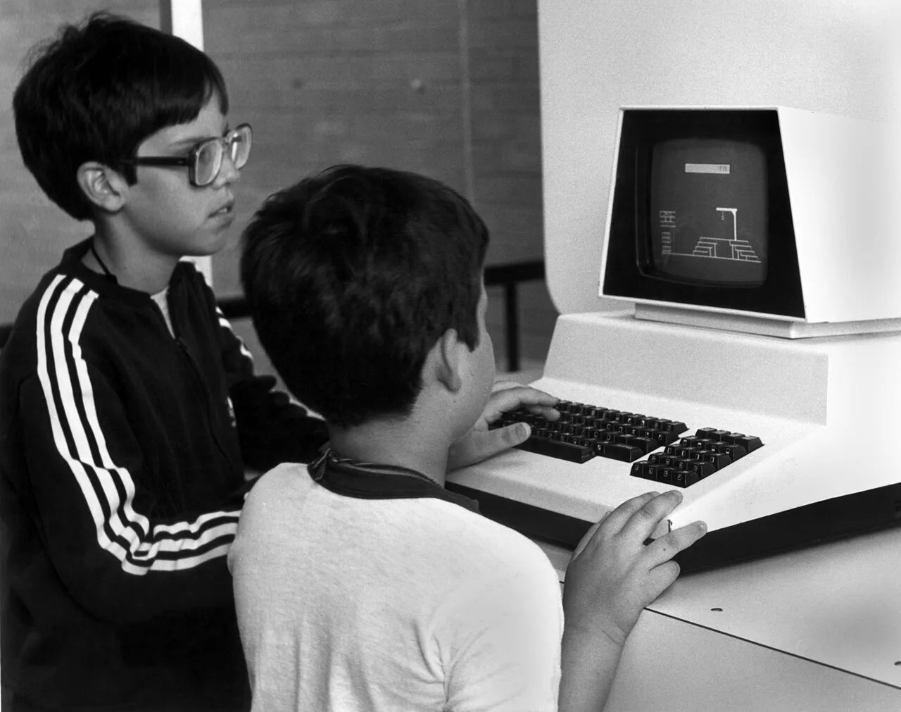 Two boys using a Commodore PET computer